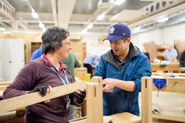 Two students assemble wood to make furniture Furniture Making